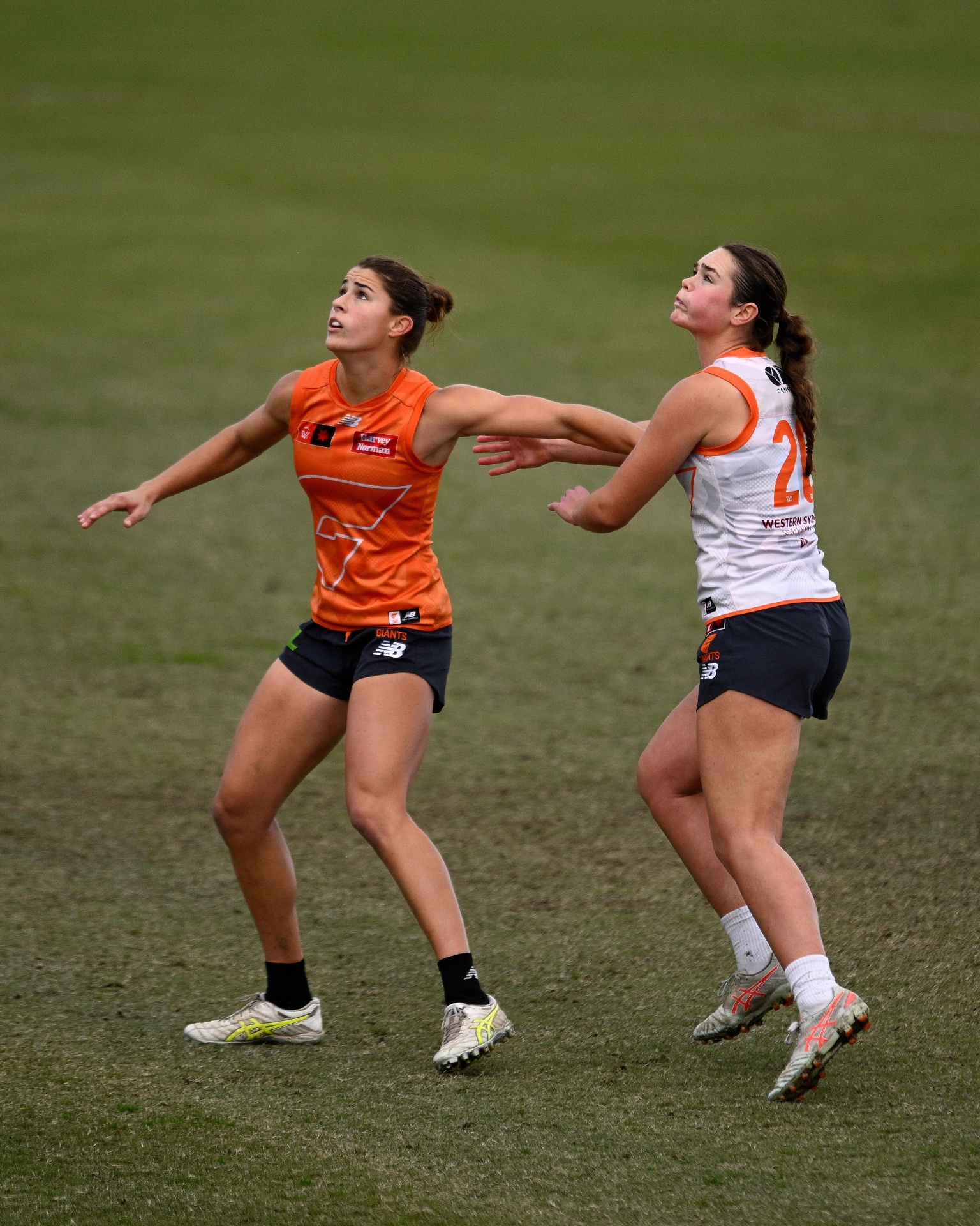Yas and a teammate contesting a mark.
